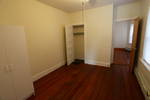 Second bedroom, looking in from the sunroom. The visible door goes to the living room.